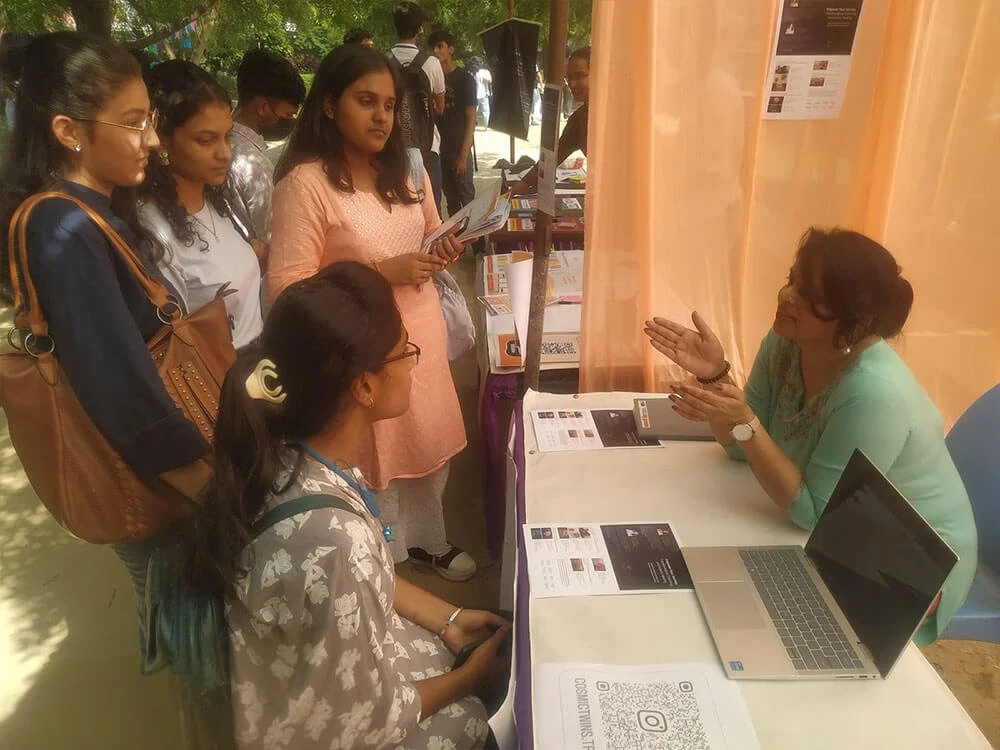 Swati speaking with several students at the awareness camp