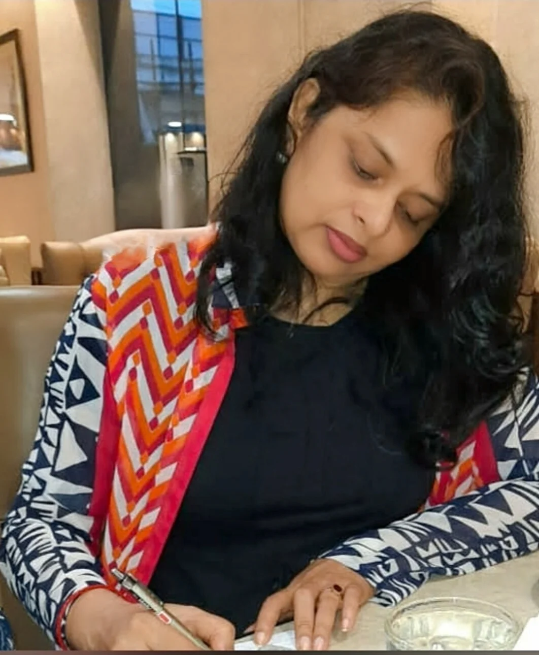 Swati Amrit writing notes during her work